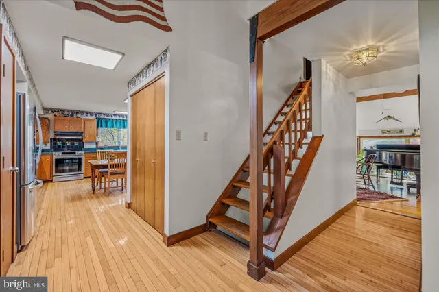 a living room with furniture a rug and a large window