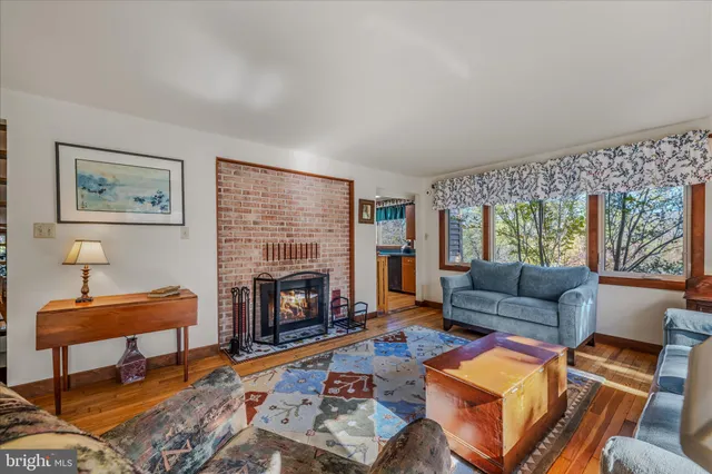 a bedroom with a bed and a mirror