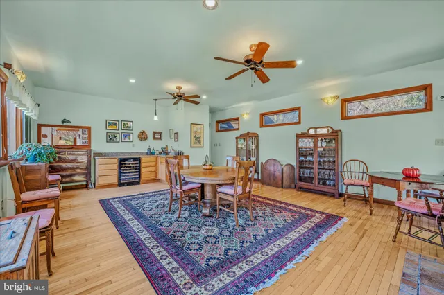 a bedroom with a bed and a lamp on the dresser