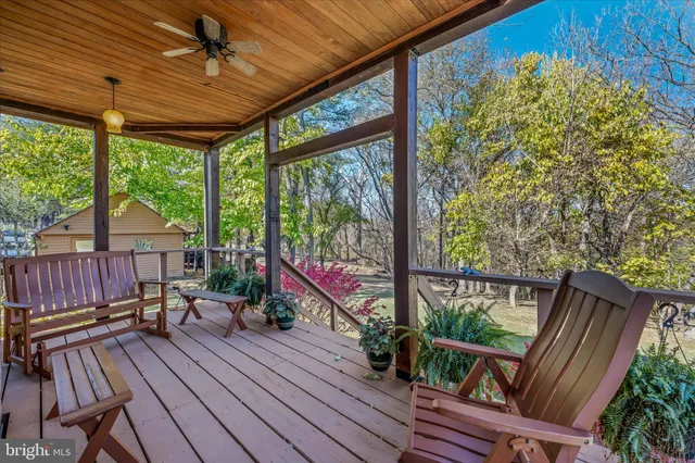 a bathroom with a sink vanity mirror and toilet