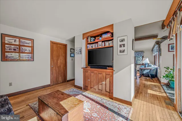 a view of a field with trees in the background