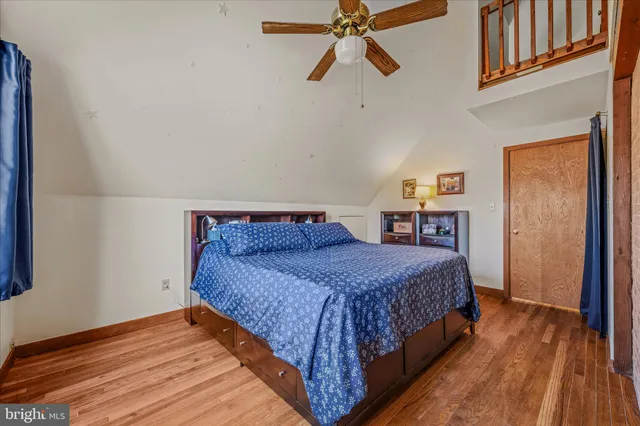 an aerial view of a house with a yard and garden