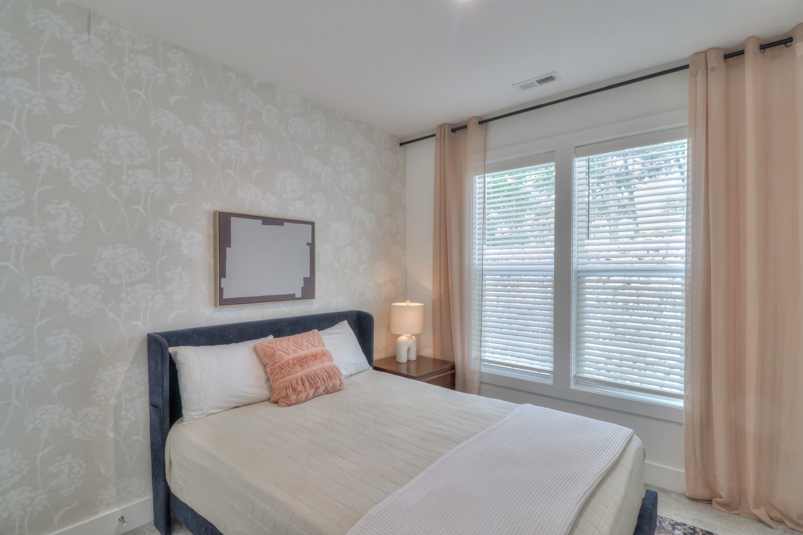 500 Creative Way, Unit 4 Madison, TN 37115 - Photo 21 of 38 a large bed sitting in a bedroom next to a window