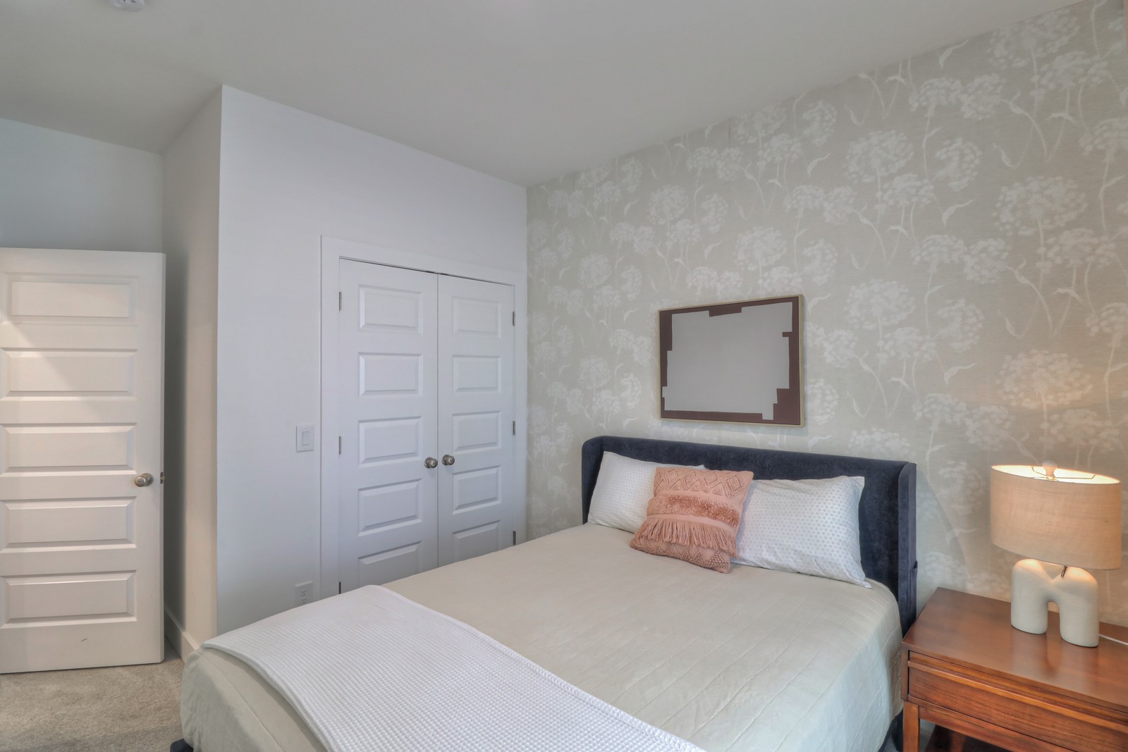 500 Creative Way, Unit 4 Madison, TN 37115 - Photo 22 of 38 a bedroom with a bed and a lamp on the dresser