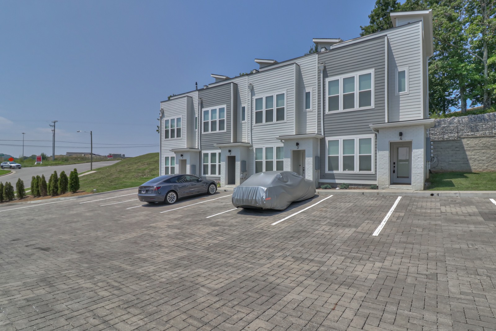 500 Creative Way, Unit 4 Madison, TN 37115 - Photo 34 of 38 a view of a street with a house and a yard in the background