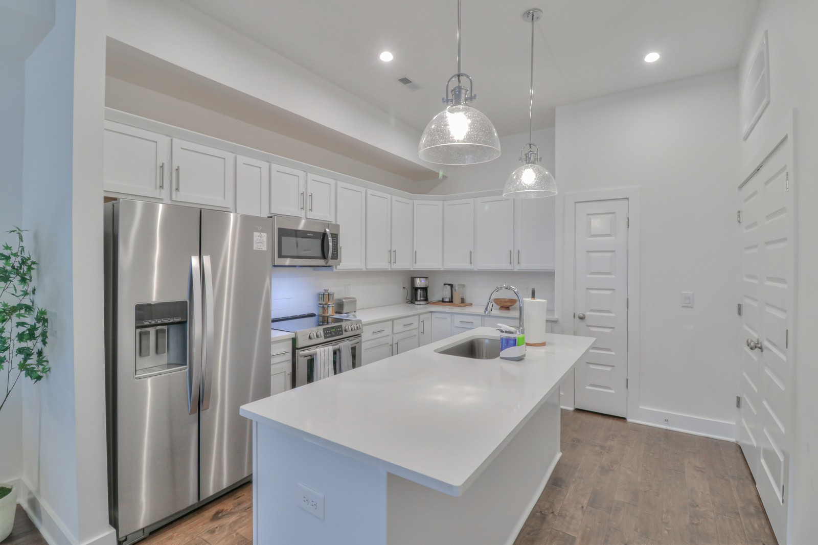 500 Creative Way, Unit 4 Madison, TN 37115 - Photo 6 of 38 a kitchen with kitchen island white cabinets and stainless steel appliances