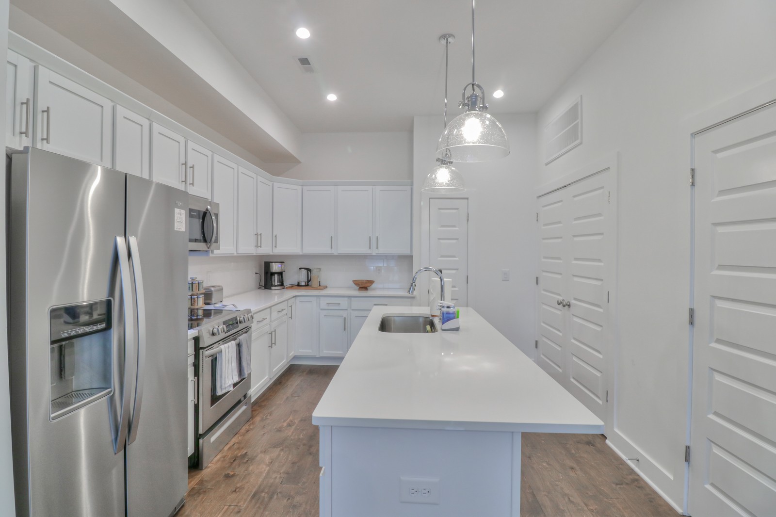 500 Creative Way, Unit 4 Madison, TN 37115 - Photo 7 of 38 a kitchen with white cabinets and stainless steel appliances