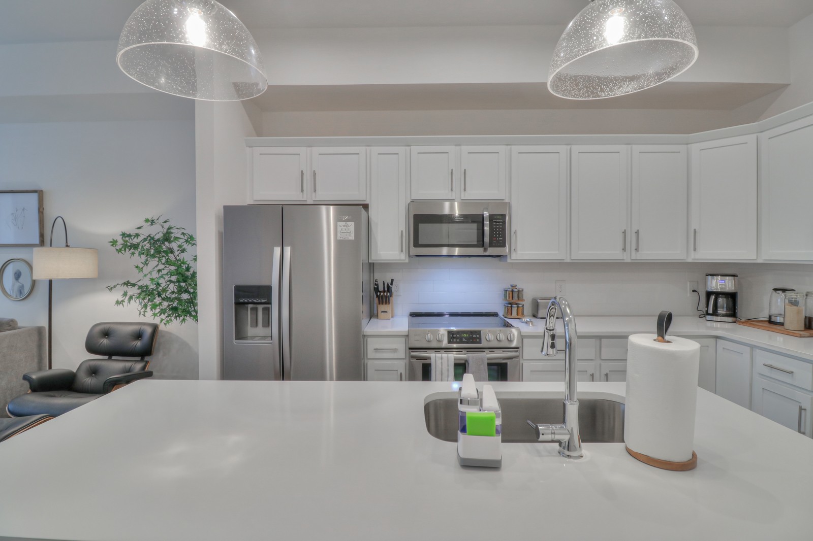 500 Creative Way, Unit 4 Madison, TN 37115 - Photo 8 of 38 a kitchen with kitchen island a stove top oven a sink a table and chairs