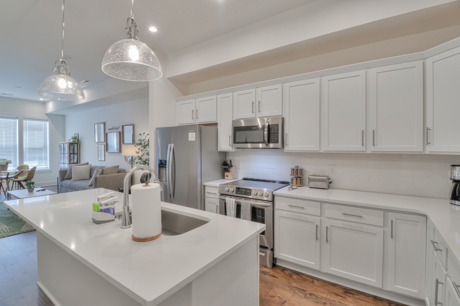 500 Creative Way, Unit 4 Madison, TN 37115 - Photo 9 of 38 a kitchen with stainless steel appliances granite countertop a sink a stove and white cabinets