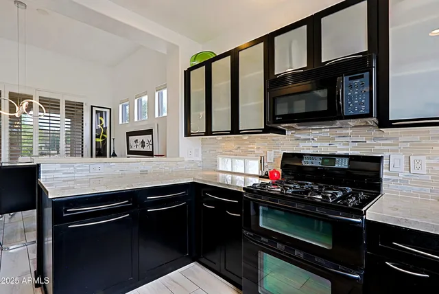 a view of a livingroom with furniture and a flat screen tv