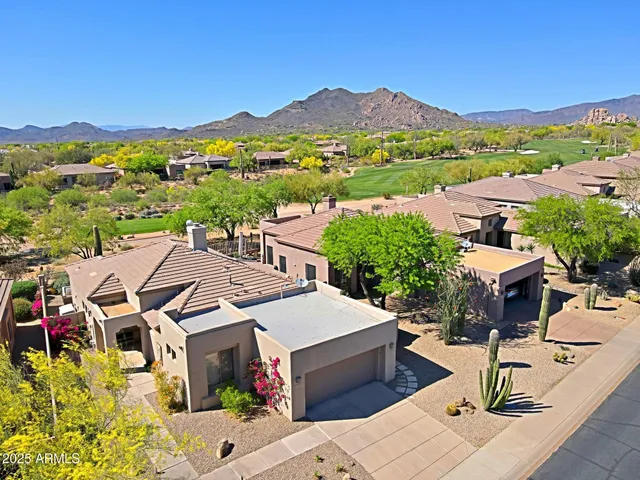 an aerial view of a house with a garden