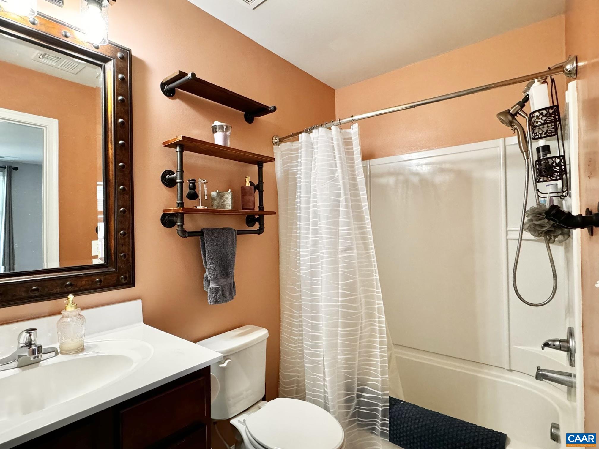 155 Richards Court Ruckersville, VA 22968 - Photo 16 of 51 a bathroom with a shower sink and mirror