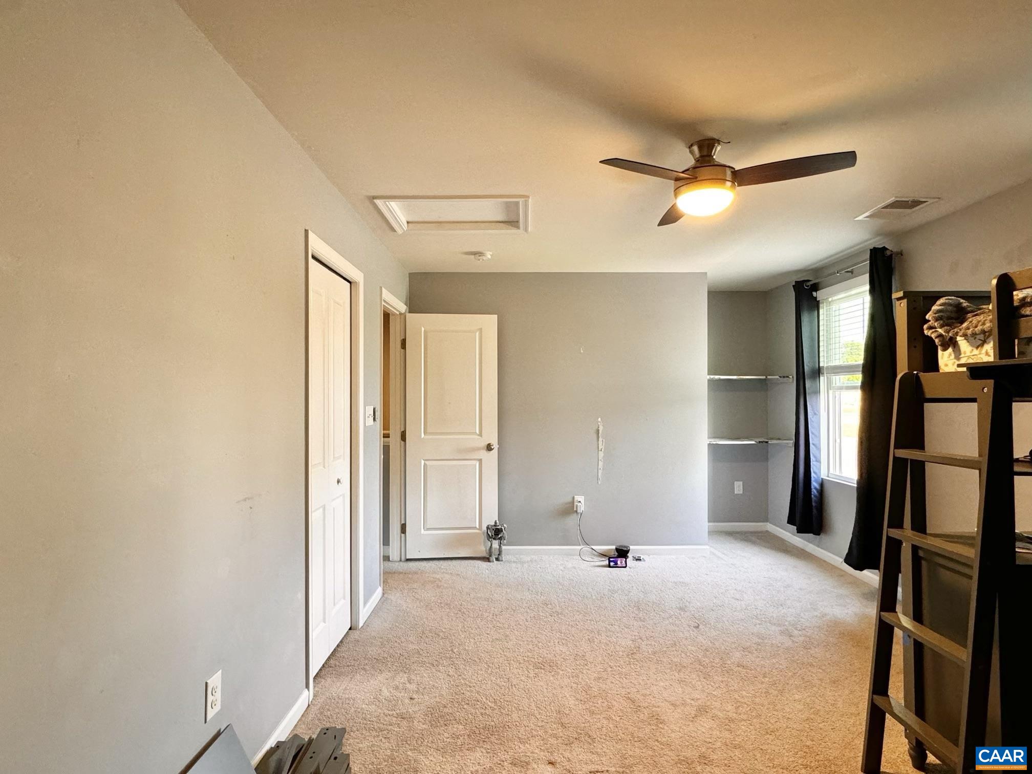 155 Richards Court Ruckersville, VA 22968 - Photo 32 of 51 a view of a livingroom with wooden floor and a ceiling fan