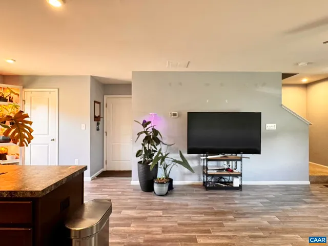 a livingroom with furniture and a flat screen tv
