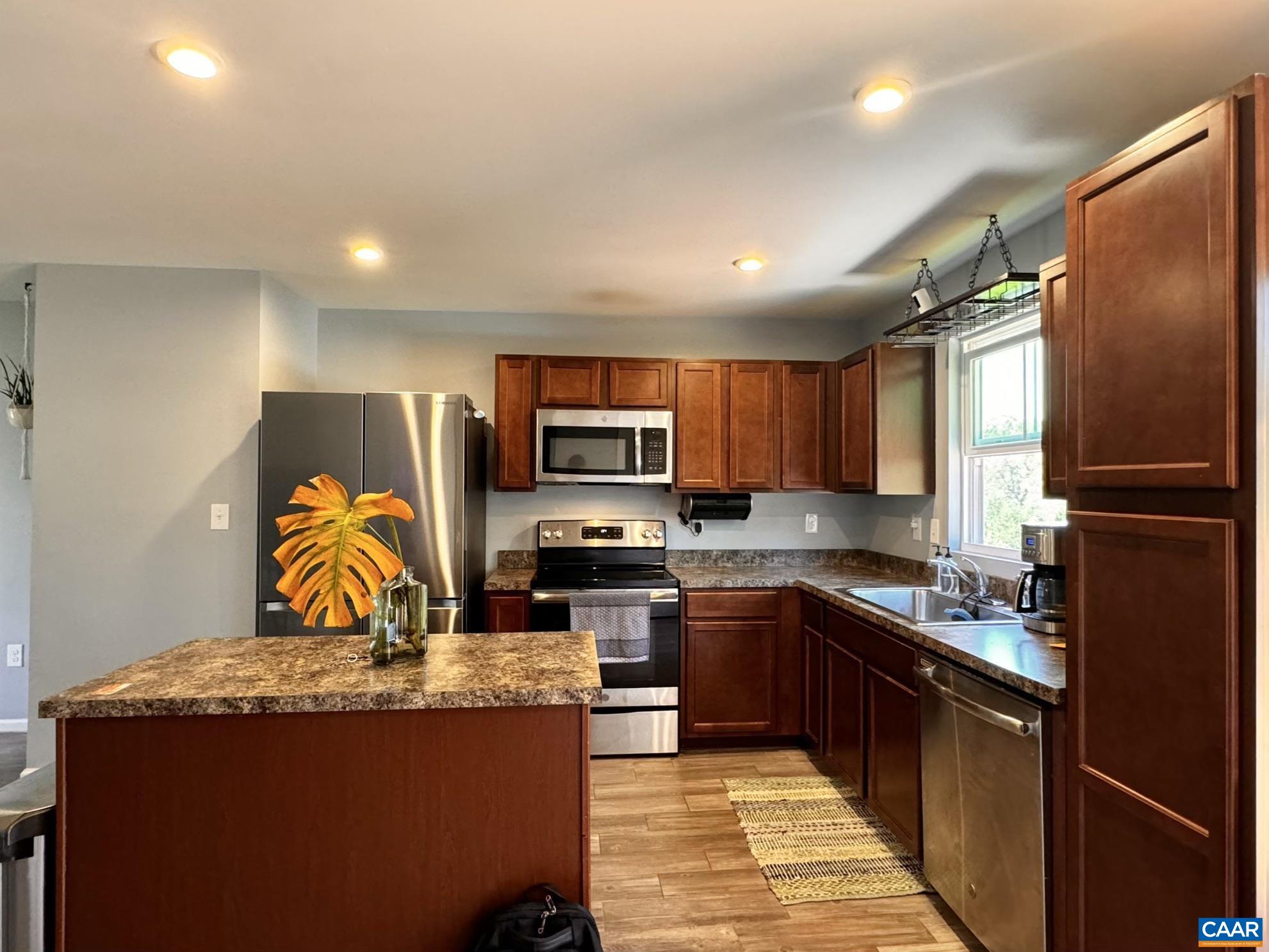 155 Richards Court Ruckersville, VA 22968 - Photo 38 of 51 a kitchen with stainless steel appliances granite countertop a refrigerator sink and stove