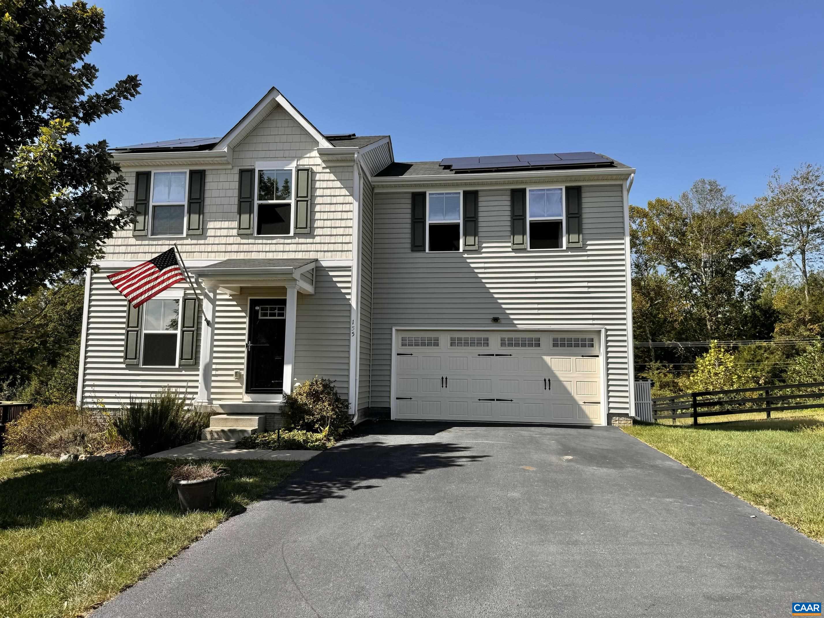 155 Richards Court Ruckersville, VA 22968 - Photo 43 of 51 a front view of a house with a yard and garage