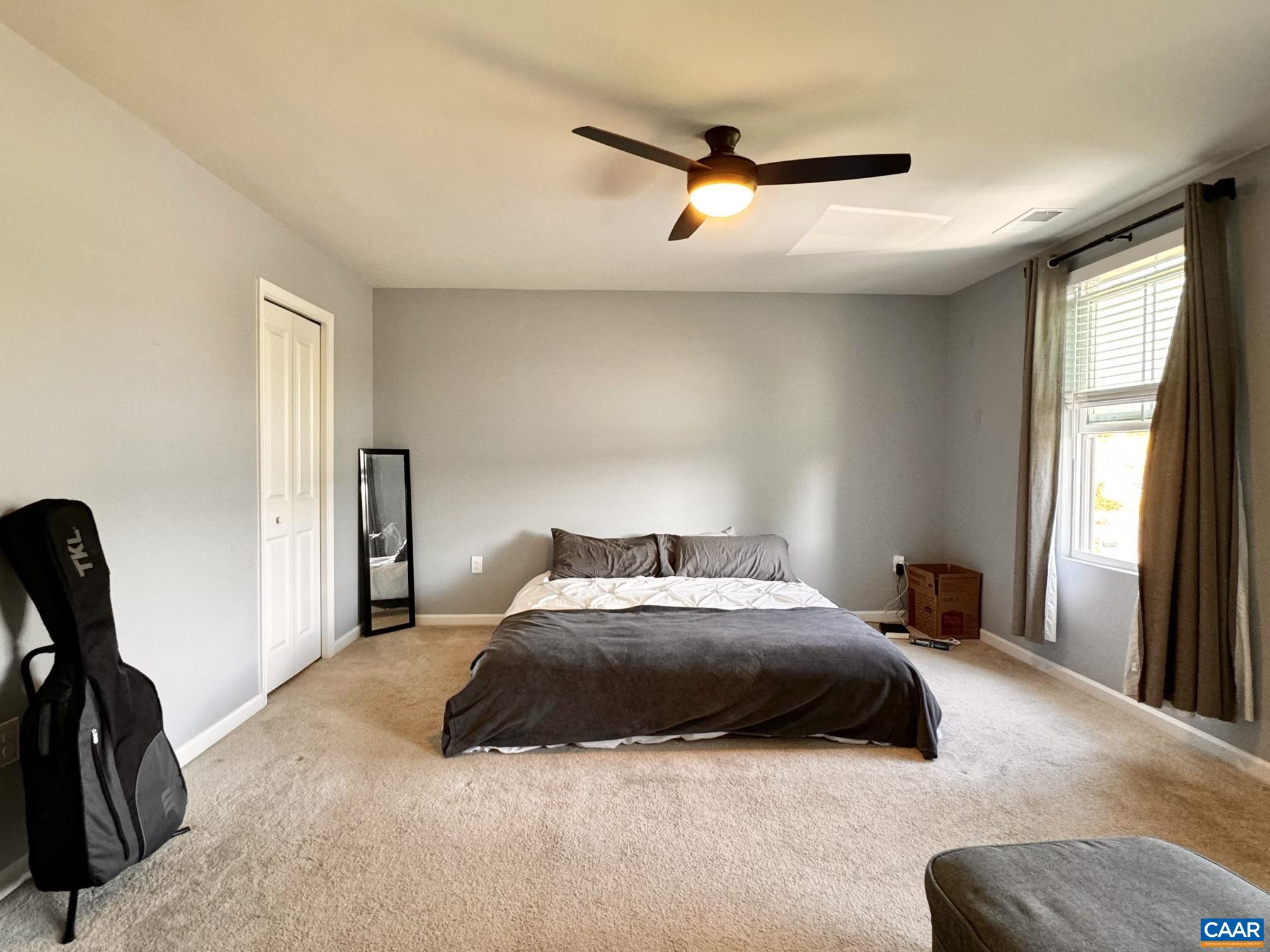 155 Richards Court Ruckersville, VA 22968 - Photo 5 of 51 a bedroom with a bed and a large window