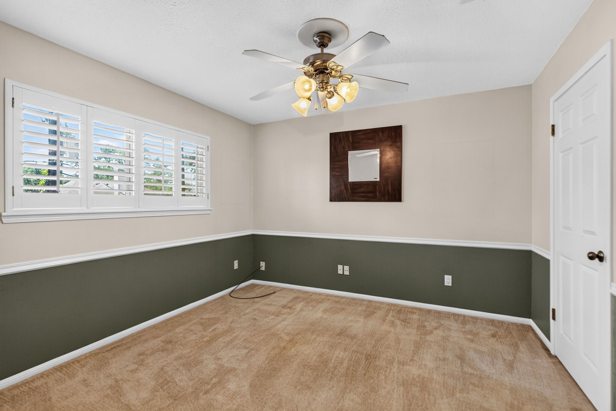 3414 Flaming Candle Drive Spring, TX 77388 - Photo 34 of 50 BEDROOM 2 - It has a chair rail trim and plantation shutters.