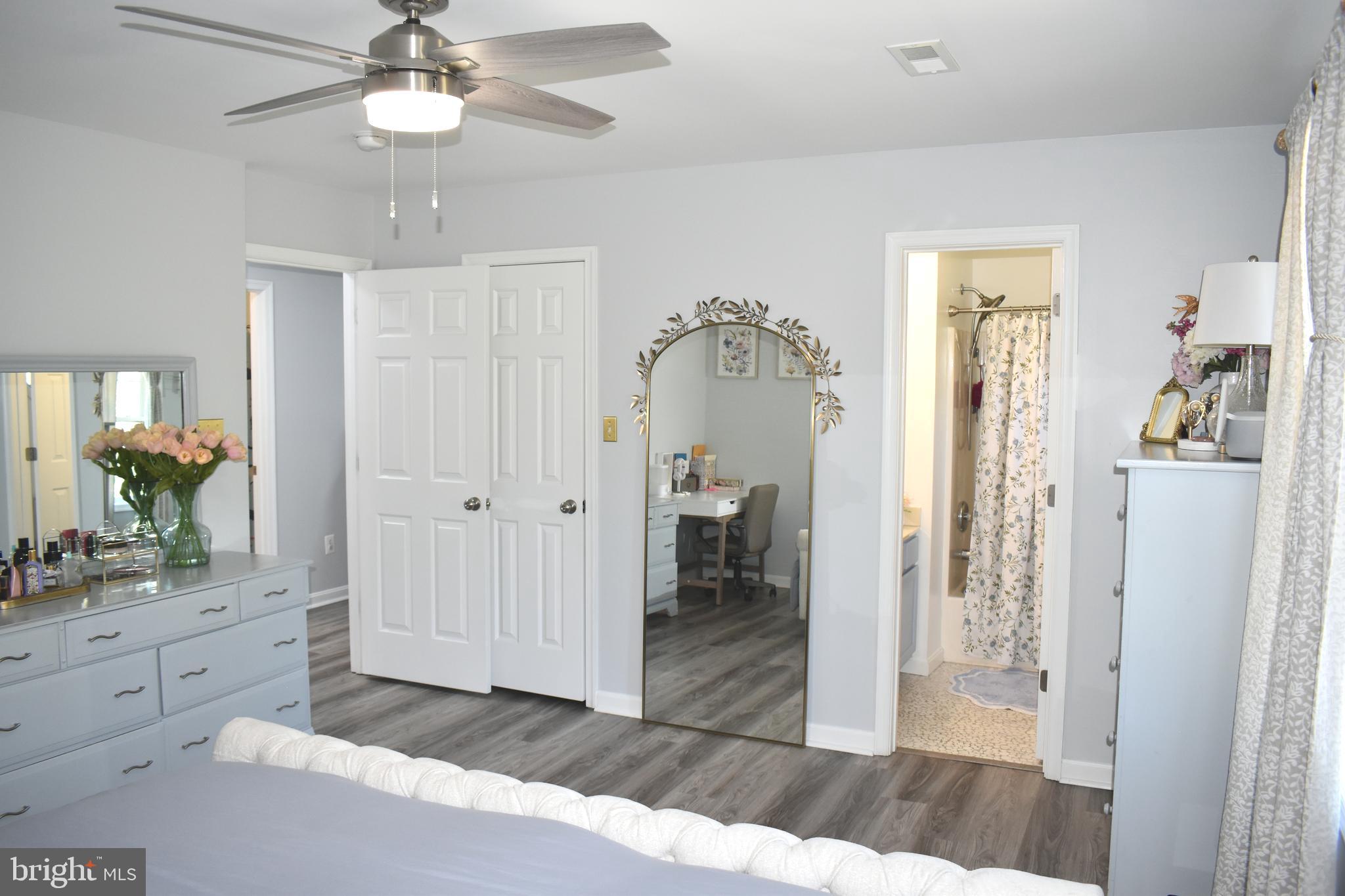 10958 Mountain Run Lake Road Culpeper, VA 22701 - Photo 18 of 31 a view of a hallway view with wooden floor and staircase