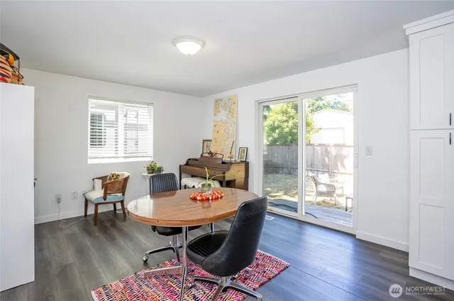 a view of a dining room with furniture window and wooden floor