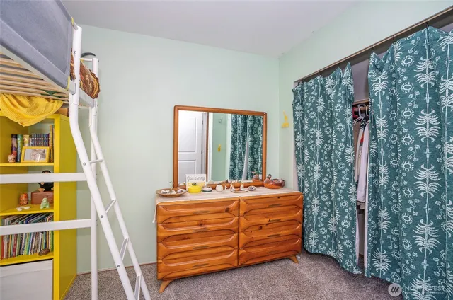 a bathroom with a sink a toilet and shower curtain