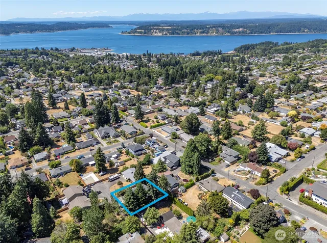 an aerial view of residential building with parking space