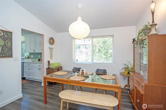 a dining room with furniture and window
