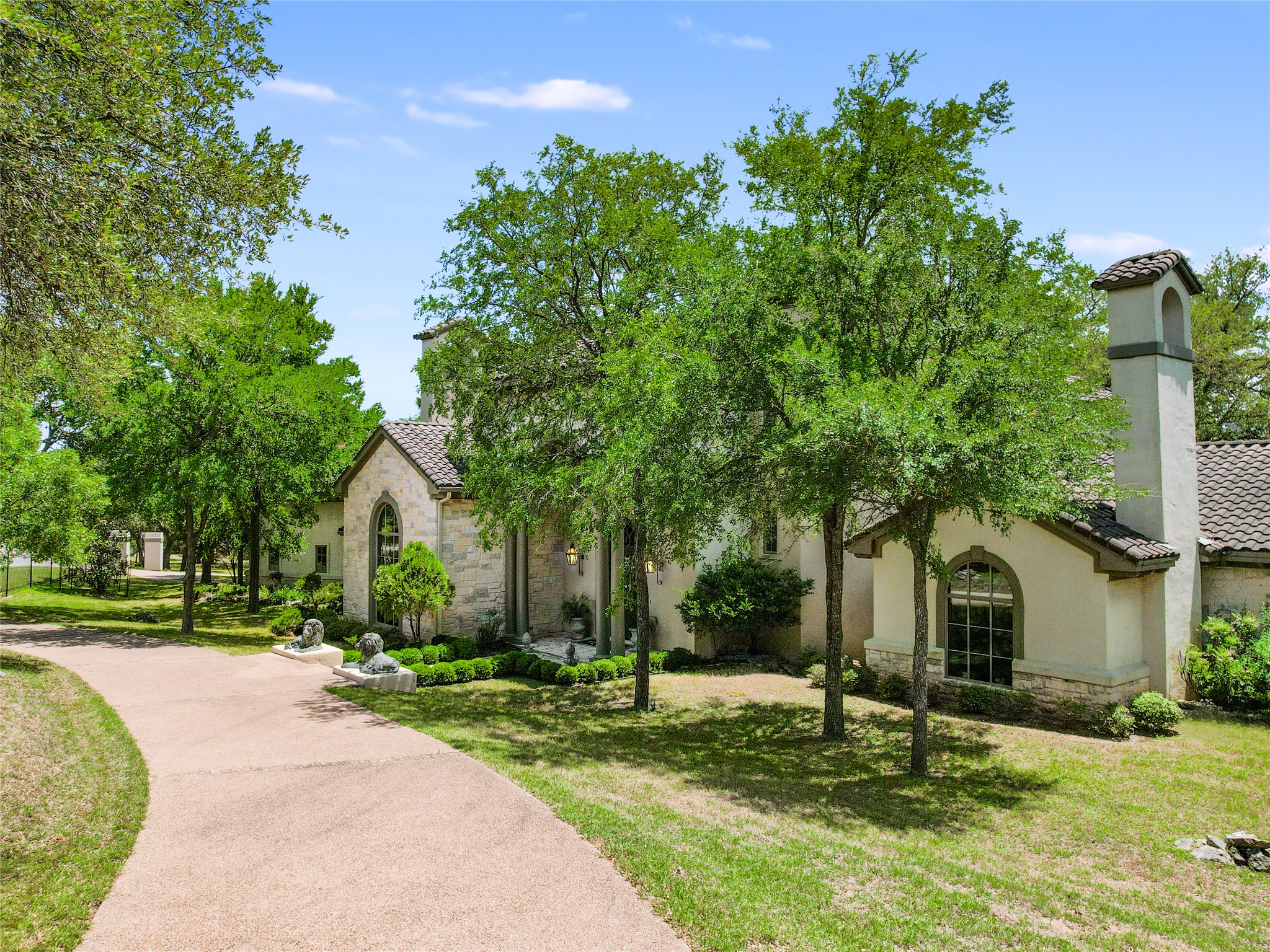 8611 Young Lane Austin, TX 78737 - Photo 33 of 40 a view of a house with a yard and tree s