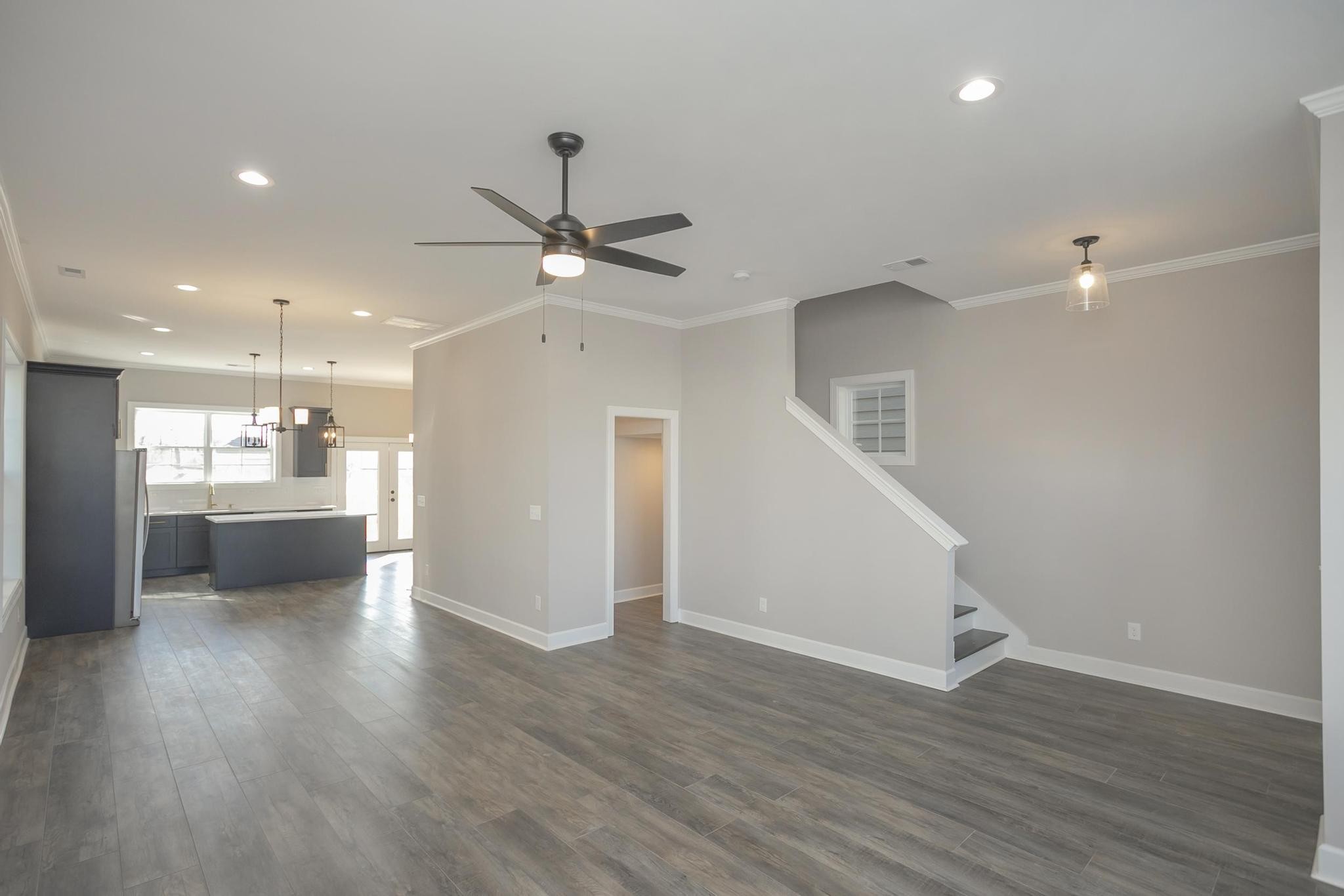 4325 Old Goins Road Nashville, TN 37211 - Photo 6 of 22 a view of a hallway with wooden floor and a kitchen