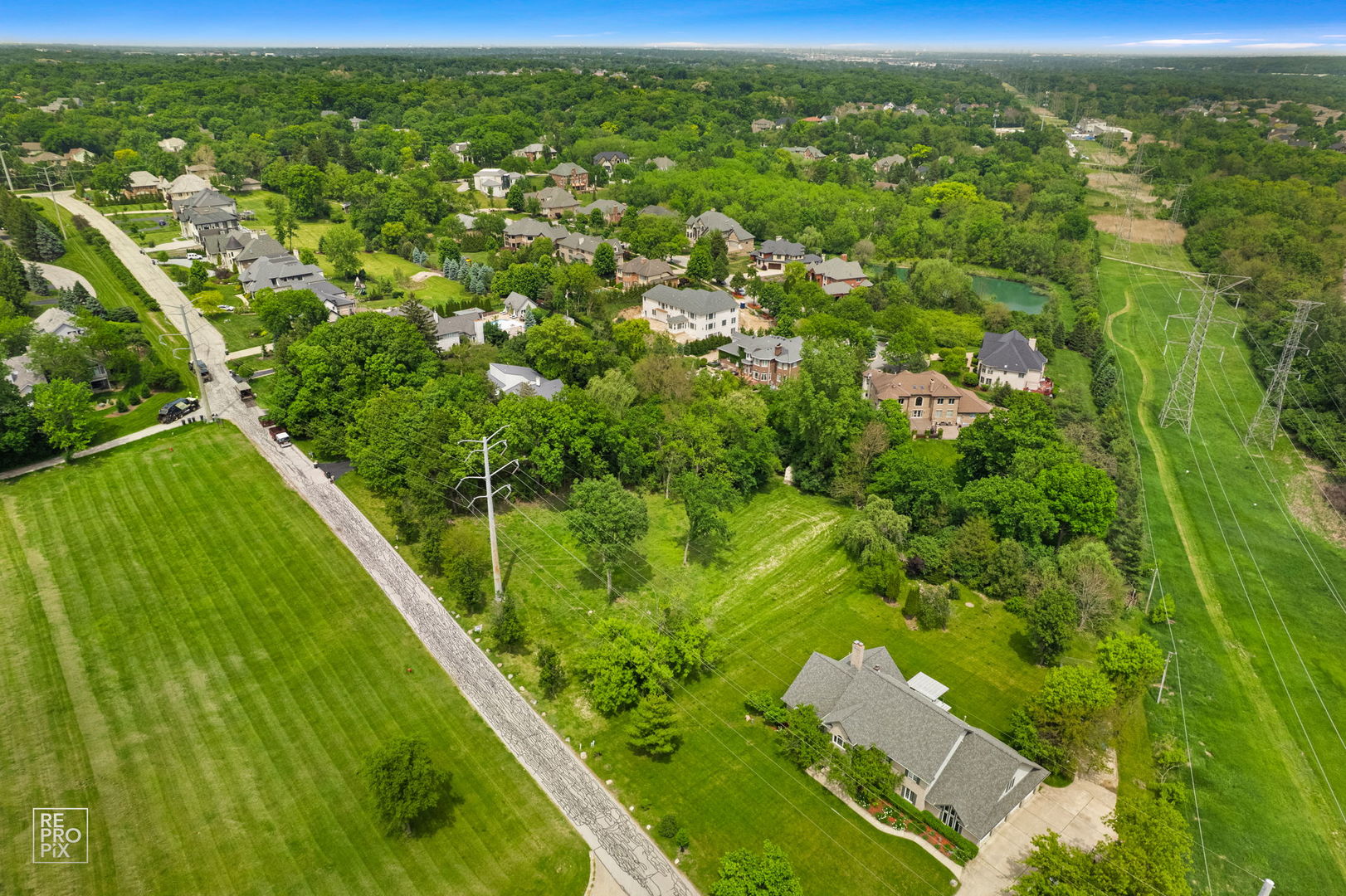 10S641 South Garfield Street Burr Ridge, IL 60527 - Photo 13 of 15 a view of a green field with an outdoor space