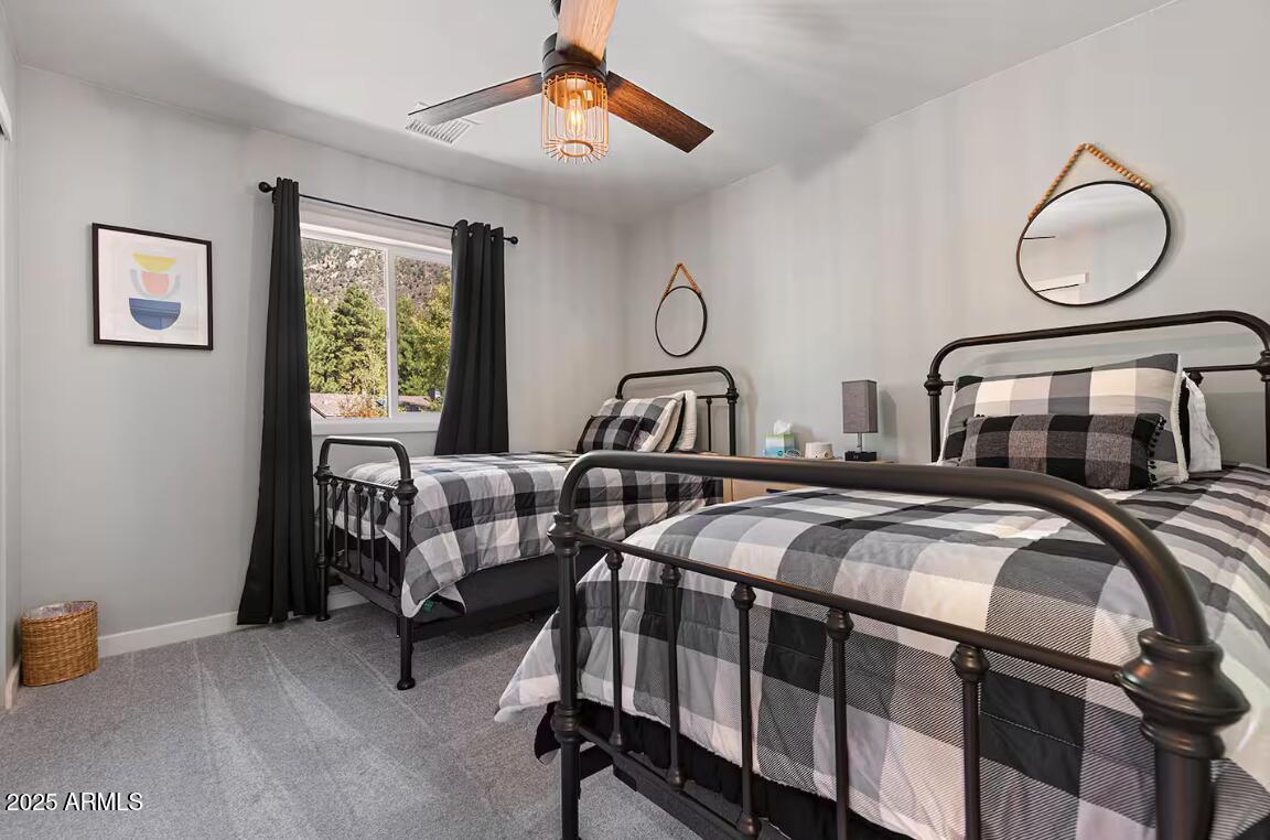 1675 East Appalachian Road Flagstaff, AZ 86004 - Photo 18 of 26 a bedroom with two beds and a window