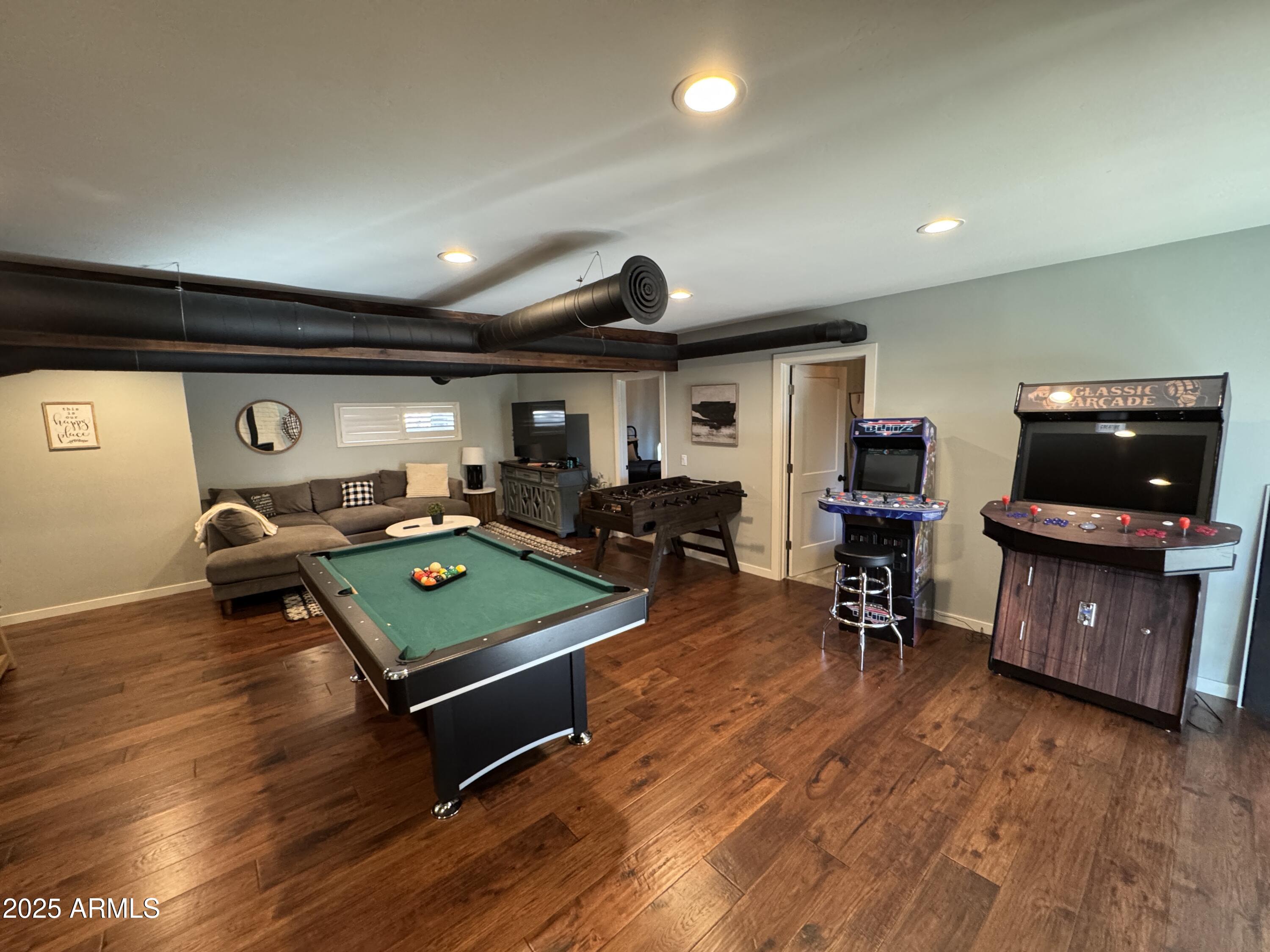 1675 East Appalachian Road Flagstaff, AZ 86004 - Photo 19 of 26 a living room with furniture flat screen tv and pool table