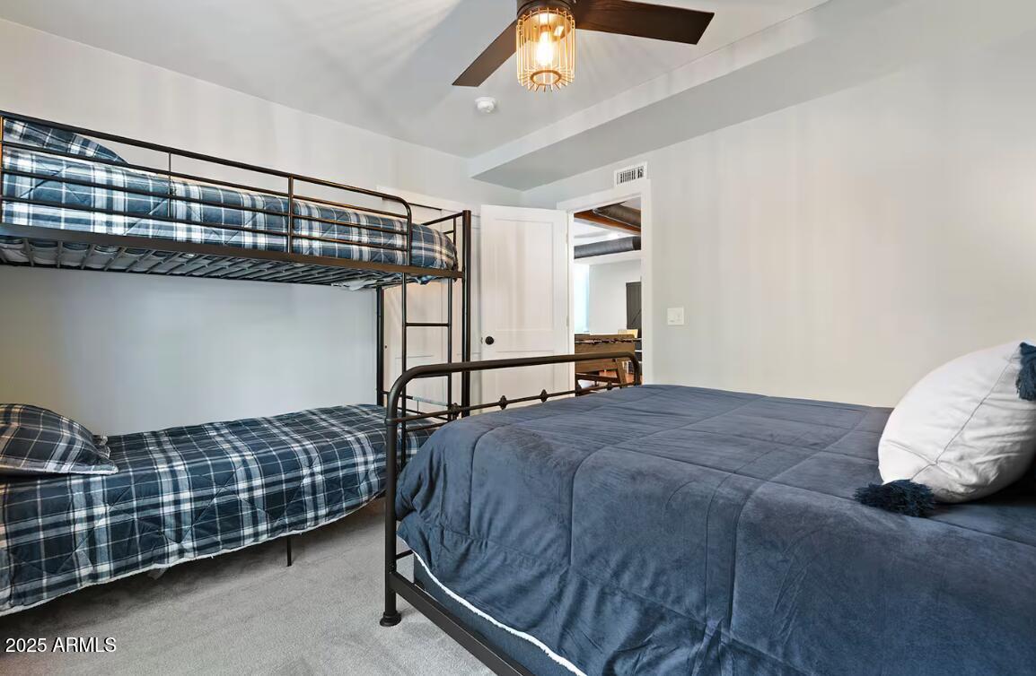 1675 East Appalachian Road Flagstaff, AZ 86004 - Photo 25 of 26 a bedroom with a bed and a window