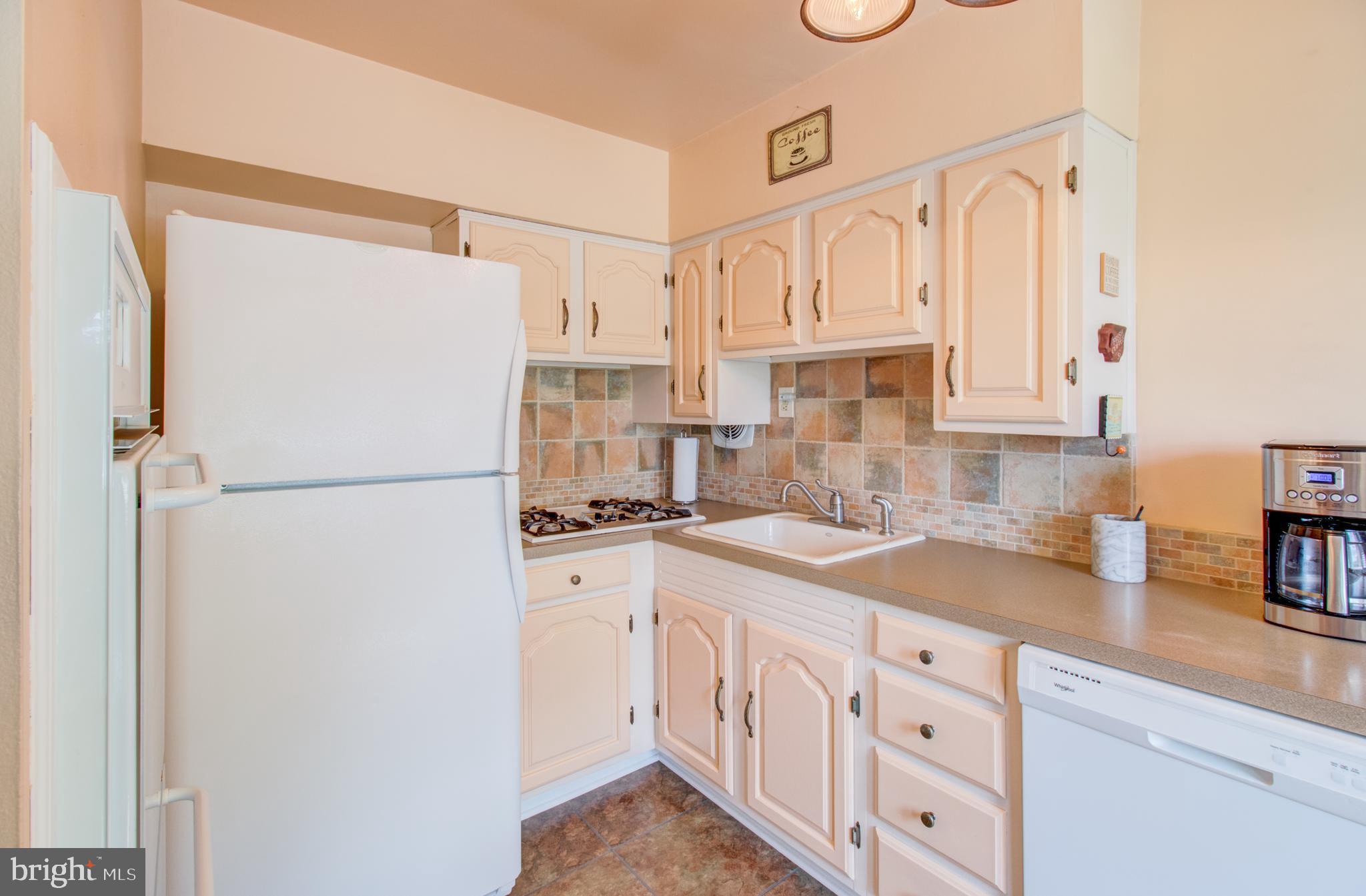 30 Dover Road Hamilton, NJ 08620 - Photo 14 of 32 a kitchen with white cabinets and white appliances