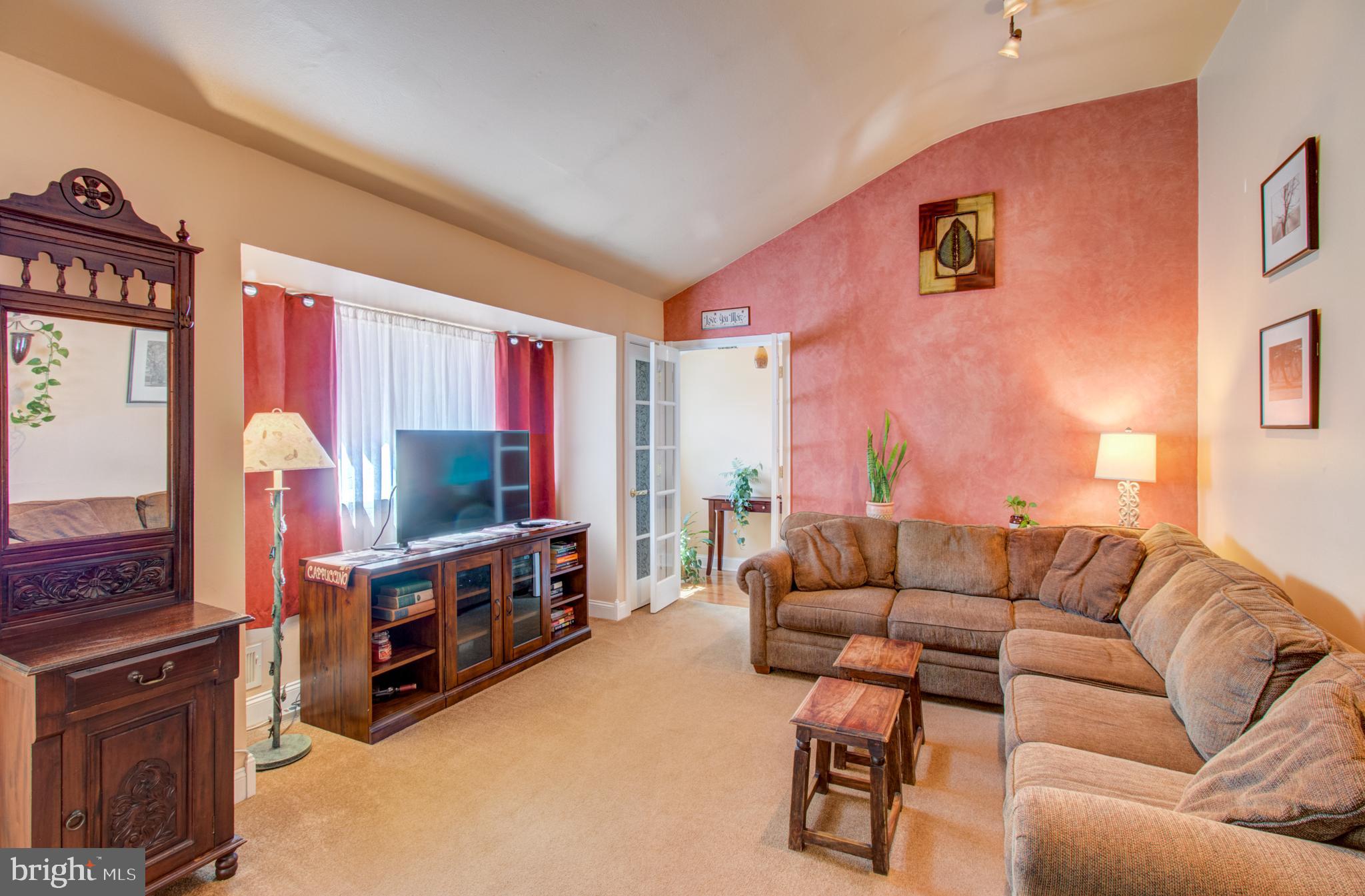30 Dover Road Hamilton, NJ 08620 - Photo 16 of 32 a living room with furniture and a flat screen tv