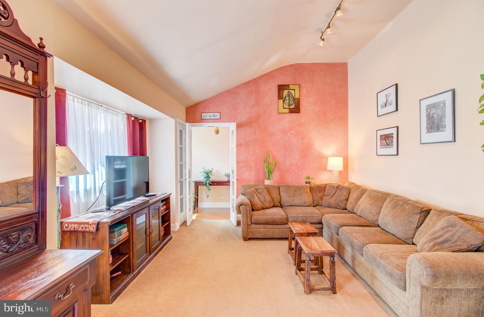 30 Dover Road Hamilton, NJ 08620 - Photo 18 of 32 a living room with fireplace furniture and a flat screen tv