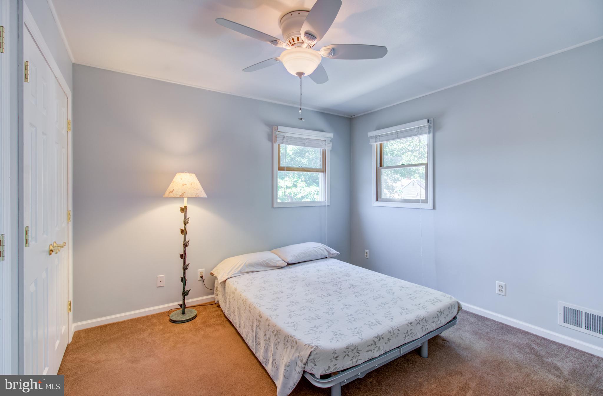 30 Dover Road Hamilton, NJ 08620 - Photo 27 of 32 a bedroom with a bed and a chandelier