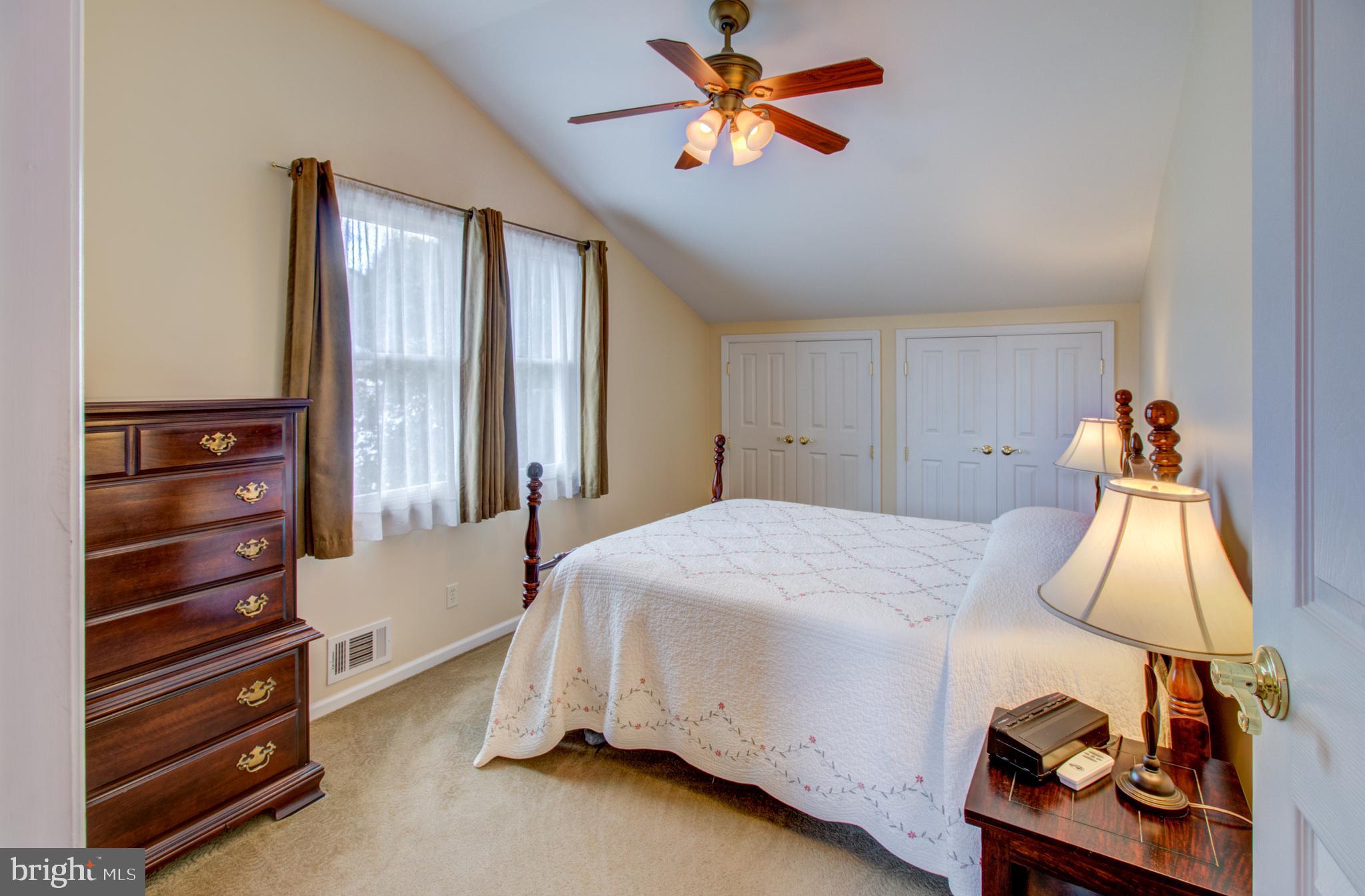 30 Dover Road Hamilton, NJ 08620 - Photo 8 of 32 a bedroom with a bed and a chandelier