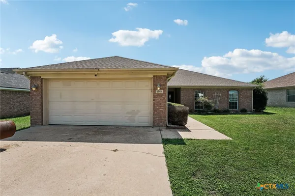 a front view of house with yard