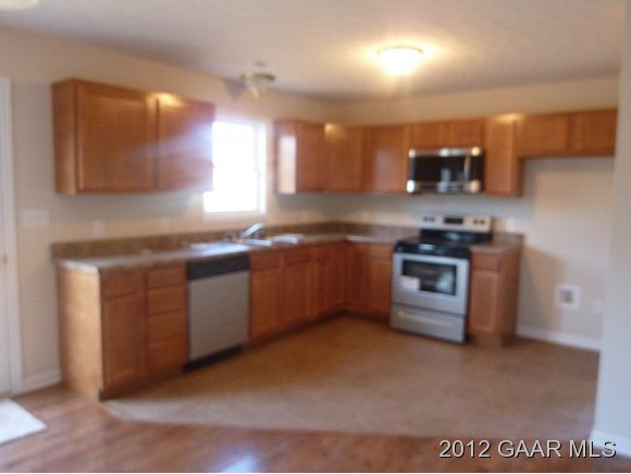 6 Nursery Road Lyndhurst, VA 22952 - Photo 4 of 5 a kitchen with stainless steel appliances granite countertop a sink a stove top oven a counter space and cabinets