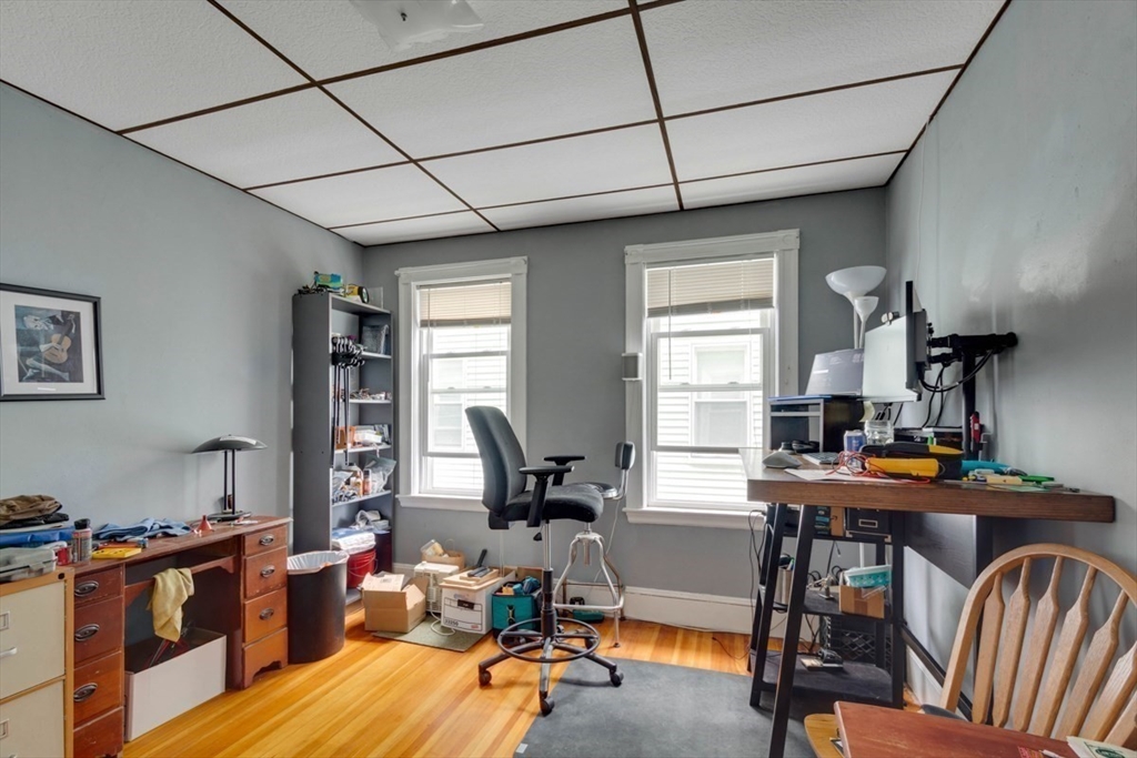 45 Jackson Road Somerville, MA 02145 - Photo 18 of 27 a view of a workspace with furniture and a window