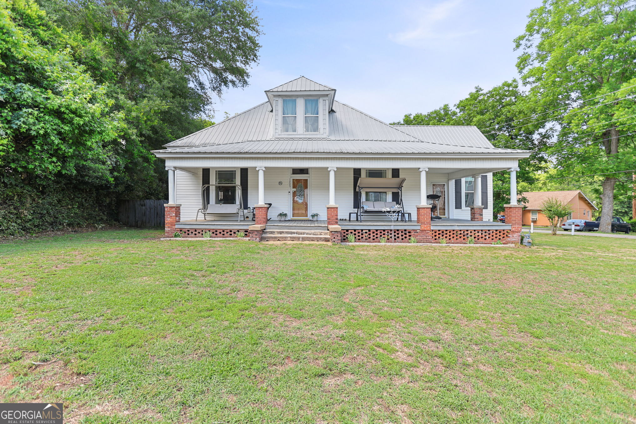 1205 Terrell Street Greenville, GA 30222 - Photo 1 of 50 a front view of house with yard and outdoor seating