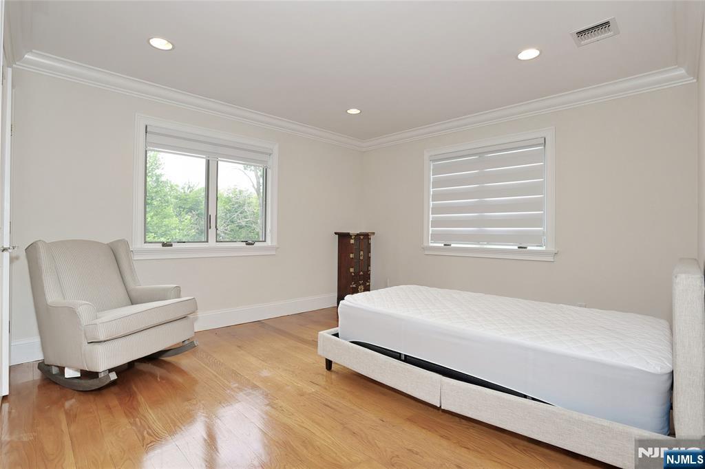 65 Ross Avenue Demarest, NJ 07627 - Photo 31 of 48 a bedroom with a bed and a couch