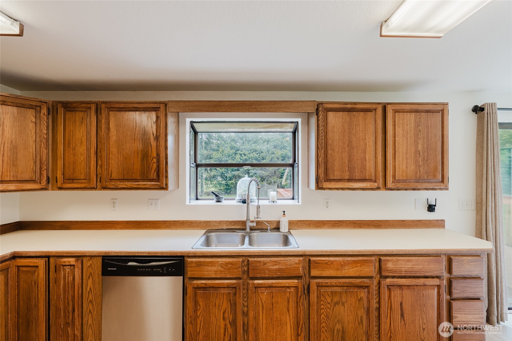 41 Meadowood Drive Elma, WA 98541 - Photo 12 of 40 a kitchen with a sink and a window