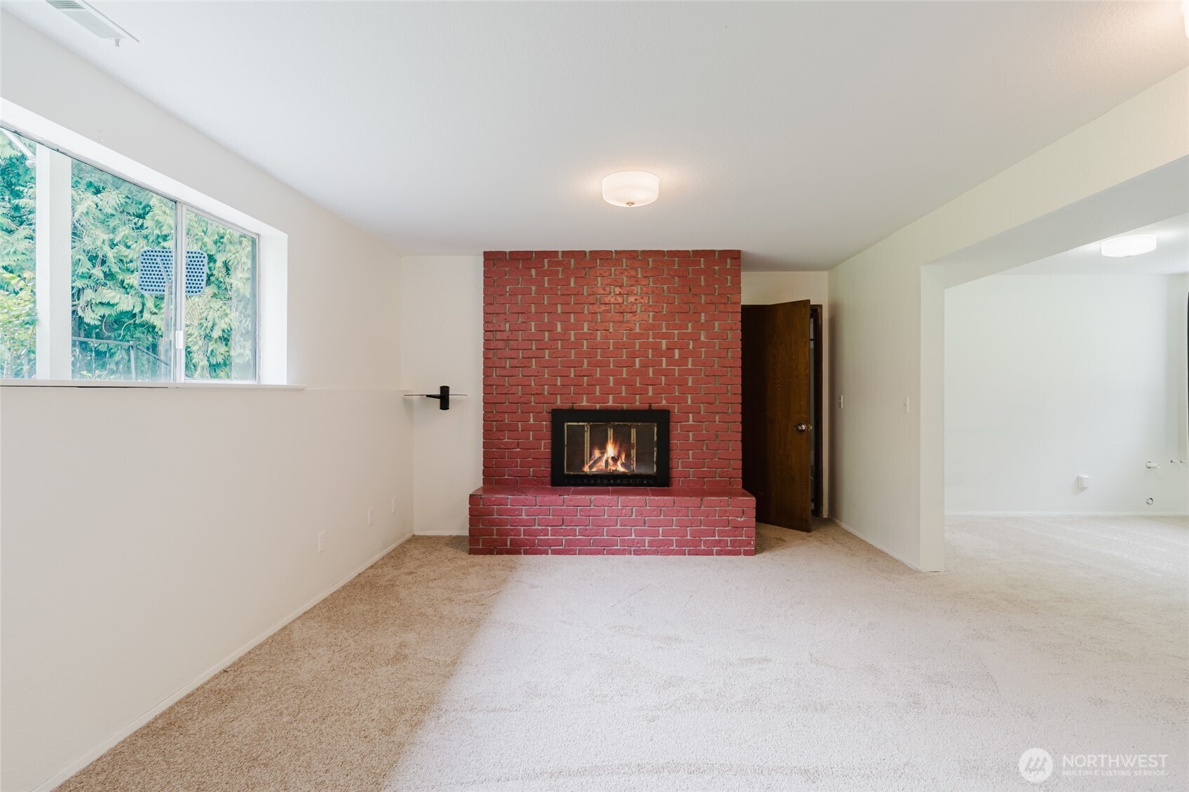 41 Meadowood Drive Elma, WA 98541 - Photo 23 of 40 a view of an empty room with a fireplace and a window