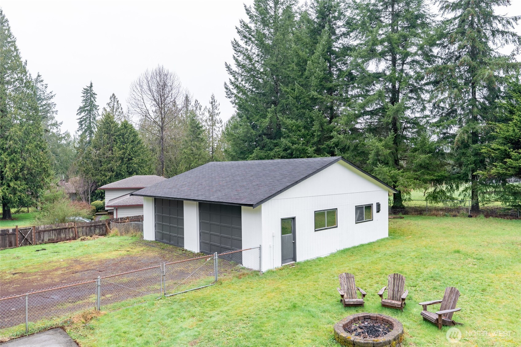 41 Meadowood Drive Elma, WA 98541 - Photo 36 of 40 a aerial view of a house with table and chairs in the patio