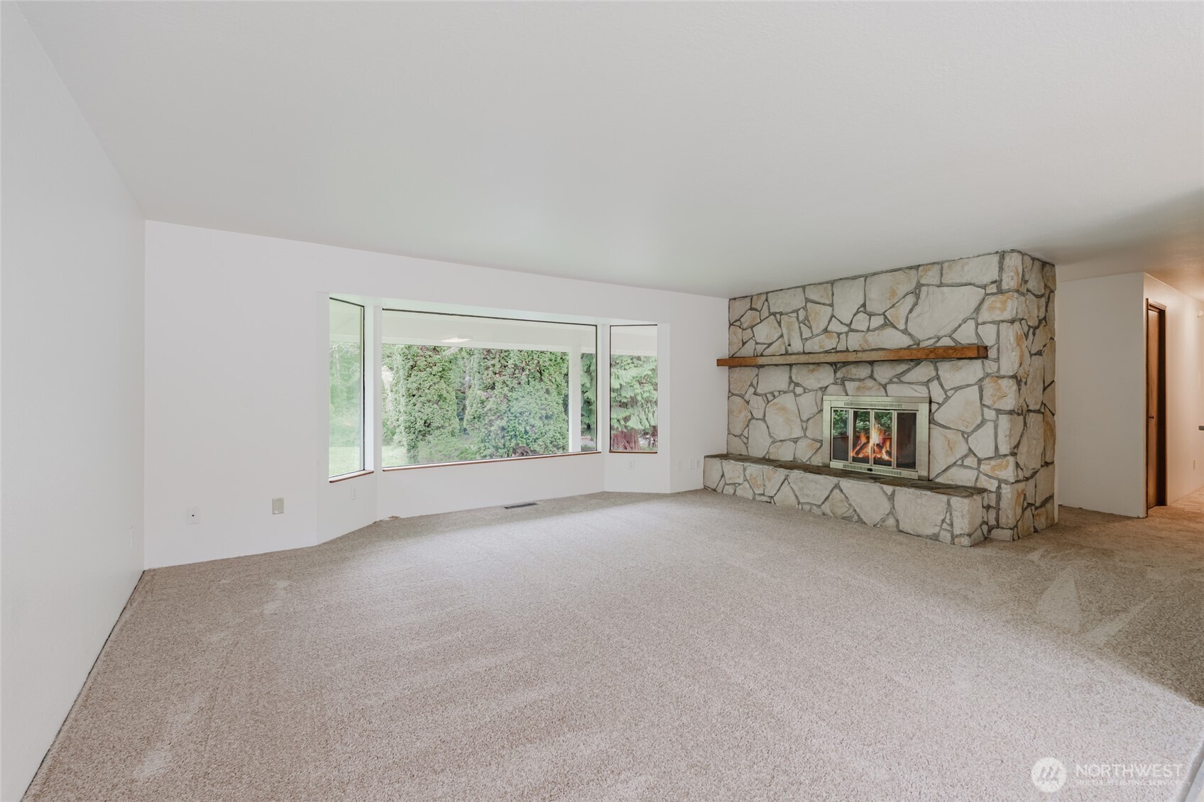 41 Meadowood Drive Elma, WA 98541 - Photo 5 of 40 an empty room with fireplace and windows
