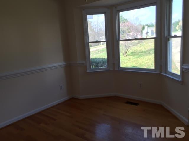 501 Jordan Ridge Lane Raleigh, NC 27603 - Photo 3 of 11 an empty room with a window