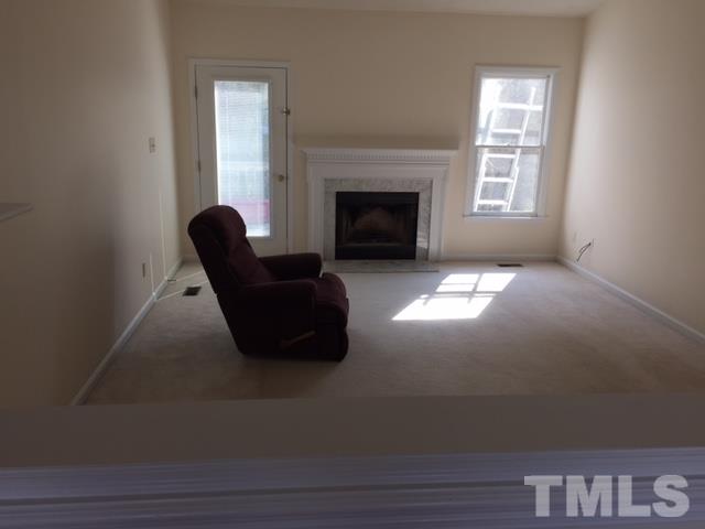 501 Jordan Ridge Lane Raleigh, NC 27603 - Photo 4 of 11 a living room with furniture and a fireplace
