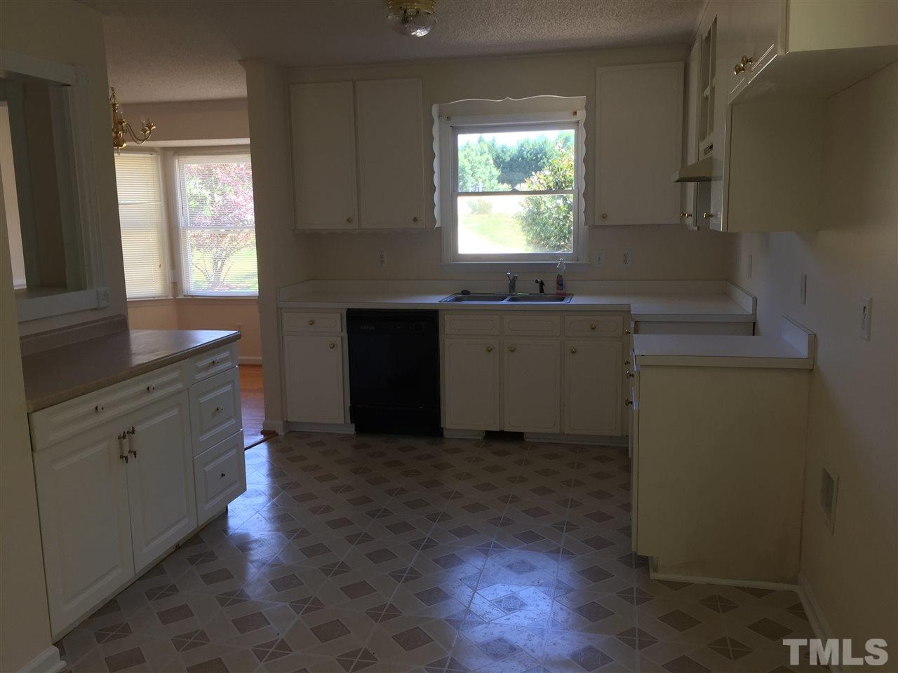 501 Jordan Ridge Lane Raleigh, NC 27603 - Photo 6 of 11 a kitchen with a sink and a window